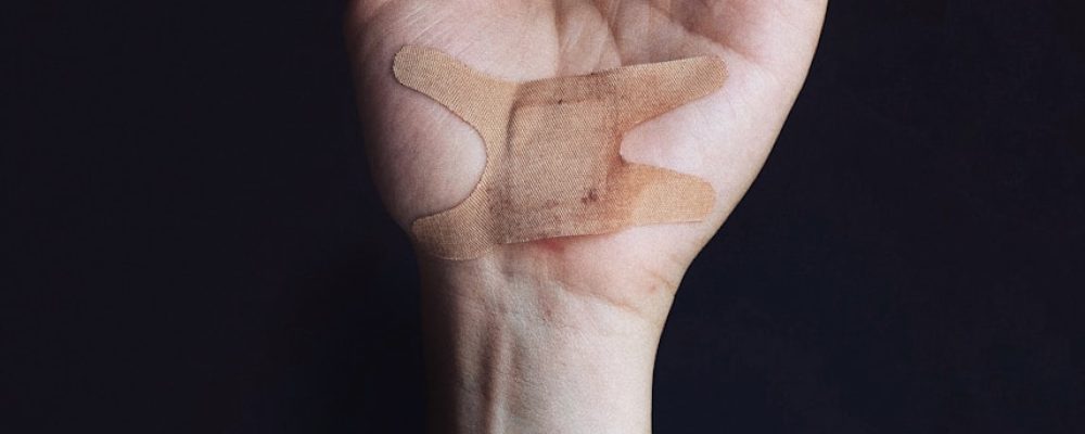 person's left palm with bandage